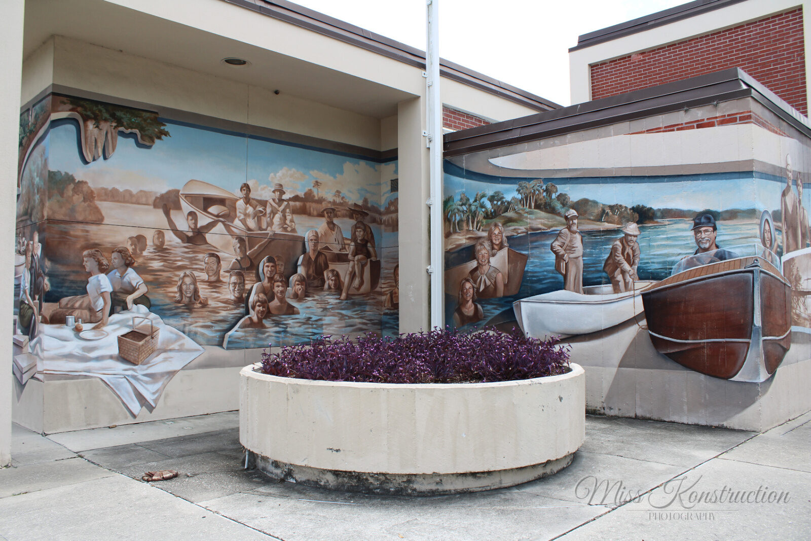 Historic mural — boats and portraits